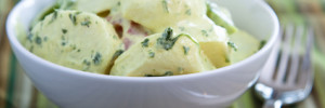 Delicious creamy German potato salad dressed in mayo infused with mustard and parsley.