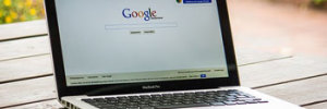 laptop open with google page showing