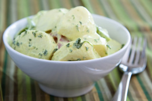 Delicious creamy German potato salad dressed in mayo infused with mustard and parsley.